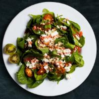 Spinach Salad · Bed of baby spinach with selected toppings.