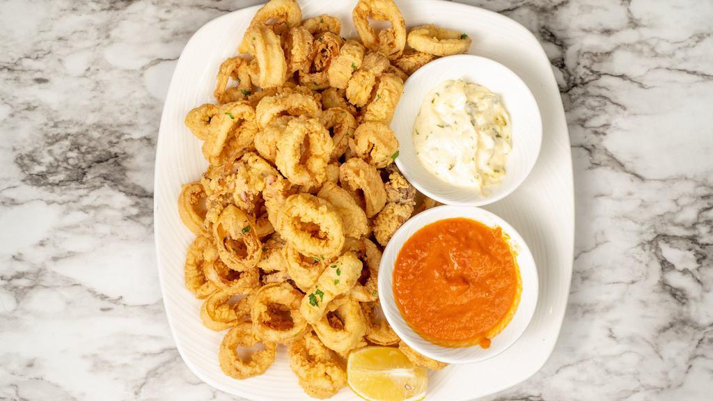 Calamari · Rings of fresh local squid, lightly fried with marinara, and lemon aioli.