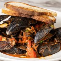 Mussels · light red sauce ,diced jalapeno and fresh basil