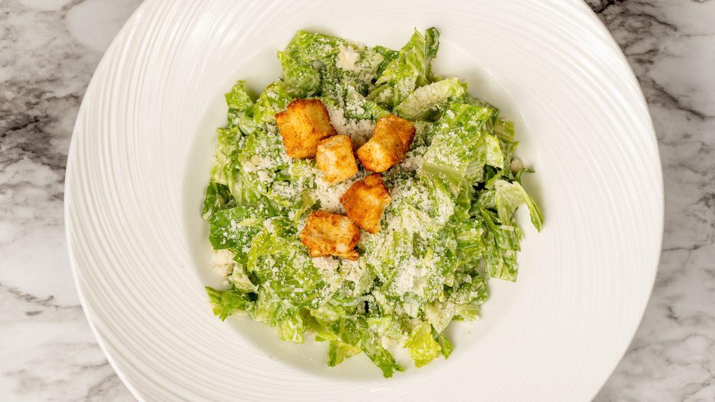 Caesar Salad · Romaine lettuce, Caesar dressing, croutons, parmigiano cheese.
