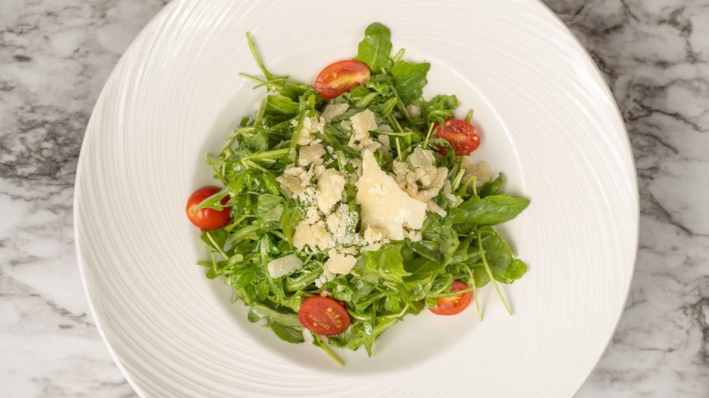 Arugula Salad · Cherry tomato, arugula, parmigiana cheese with lemon vinaigrette