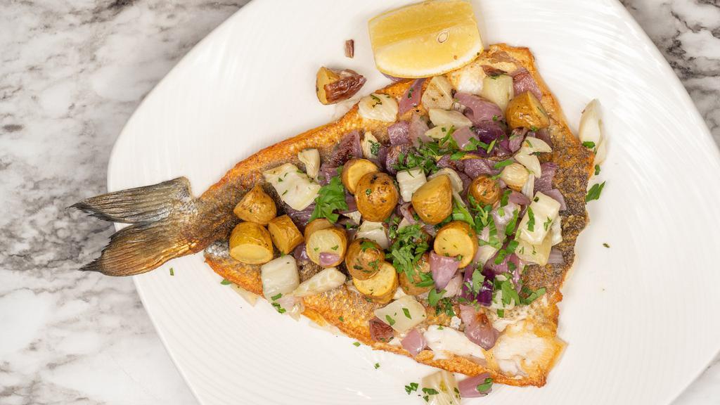 Branzino · whole fish (nohead,no tail) pan seared, served with fingerling potatoes and caramelized onions.