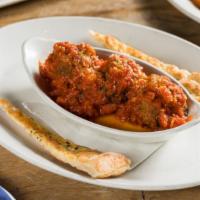 Meatballs · Homemade meatballs topped with Parmigiano Reggiano, served with tomato sauce, basil & toaste...