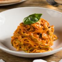 Paglia E Fieno · Homemade fettuccine, tomato sauce, cream, basil and Parmigiano Reggiano.