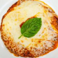 Chicken Parmigiana · Breaded chicken with tomato sauce & mozzarella cheese.