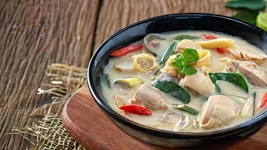 Tom Kha Chicken · Creamy coconut soup with galangal,mushroom,cilantro. 
Indicates hot&spicy dishcanbemodifiedtoyourspicytolerance
(mild,medium,hot,thai hot).