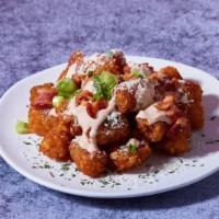 Bacon Truffle Tots · Tater tots with zesty truffle aioli and bacon crumble