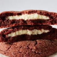 Red Velvet Cream Cheese · Cocoa infused Red Velvet dough with a smooth cream cheese and white chocolate chips.