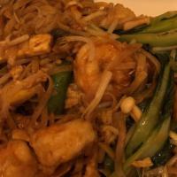 Pad Thai · Vietnamese-style stir-fried rice noodles with bean sprouts, egg, and roasted peanuts served ...