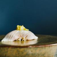 Hamachi · Yellowtail. Served with chef's choice of toppings.
