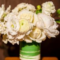 Pure  · Beautiful   arrangement with peonies , ranunculus ,  roses accented with seasonal foliage.