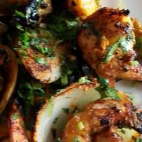 Tandoori Shrimp · Jumbo shrimp marinated in ginger, garlic, herbs and yogurt cooked on skewers in the tandoor....