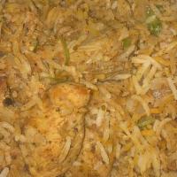 Chicken Biryani · A traditional preparation of basmati rice cooked with saffron, onions, ginger, garlic, herbs...