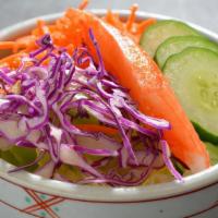 Mini Salad · Chilled iceberg lettuce, red cabbage, carrot, cucumber & imitation crab tossed with our orig...