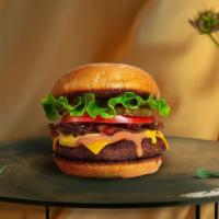 Classic Charm Burger  · Seasoned Beyond meat patty topped with lettuce, tomato, onion, and pickles. Served on a sesa...
