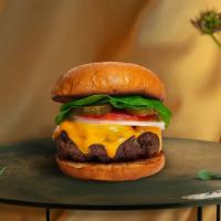 Stretch It Out Burger  · Seasoned Beyond meat patty topped with melted vegan cheese, lettuce, tomato, onion, and pick...