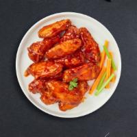 Buffed Buffalo Wings · Wings cooked and tossed in our buffalo wing sauce. Served with Blue Cheese.