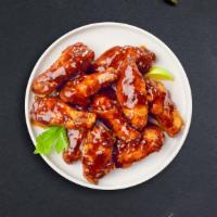 Bbq Bliss Wings · Wings cooked and tossed in classic BBQ Sauce. Served with Ranch Sauce.
