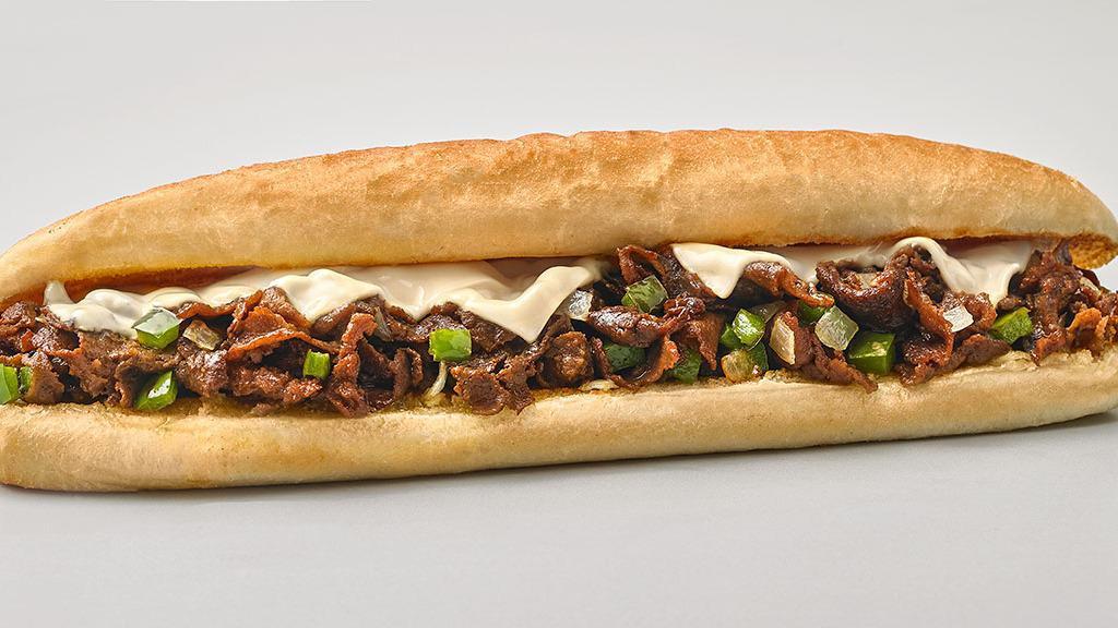 Philly Cheesesteak · Shredded Philly steak, onion, green pepper and cheese on a 12
