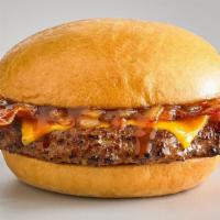 Cowboy Burger · 6 oz beef burger, grilled onions, bacon, cheddar cheese and BBQ sauce on a bun