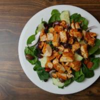 Baby Spinach Salad · Baby spinach tossed with grilled chicken, kalamata olives, craisins, cherry tomato, red onio...