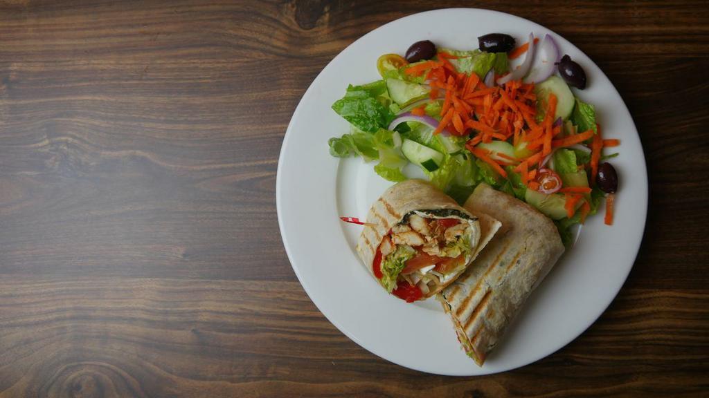 Grilled Chicken Wrap · Grilled chicken, fresh mozzarella cheese, roasted red peppers, lettuce, tomatoes and basil served on a white or wheat wrap with a side of your choice.