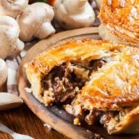 Homemade Meat Pies · Bread pies topped with meat, onions, and nuts in our own special homemade blend.