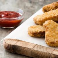 Chicken Breast Nuggets · Breast of chicken nugget wedges lightly breaded, fried, and served with honey mustard sauce.