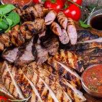 Chef'S Assorted Mixed Grill · Grilled lamb, beef, chicken, beef kofta and chicken thigh kebabs with our special sauce, ser...