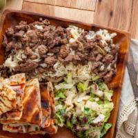 Beef Shawarma Entree · Tender lean beef shredded and marinated in delicate spices then grilled with chef's special ...