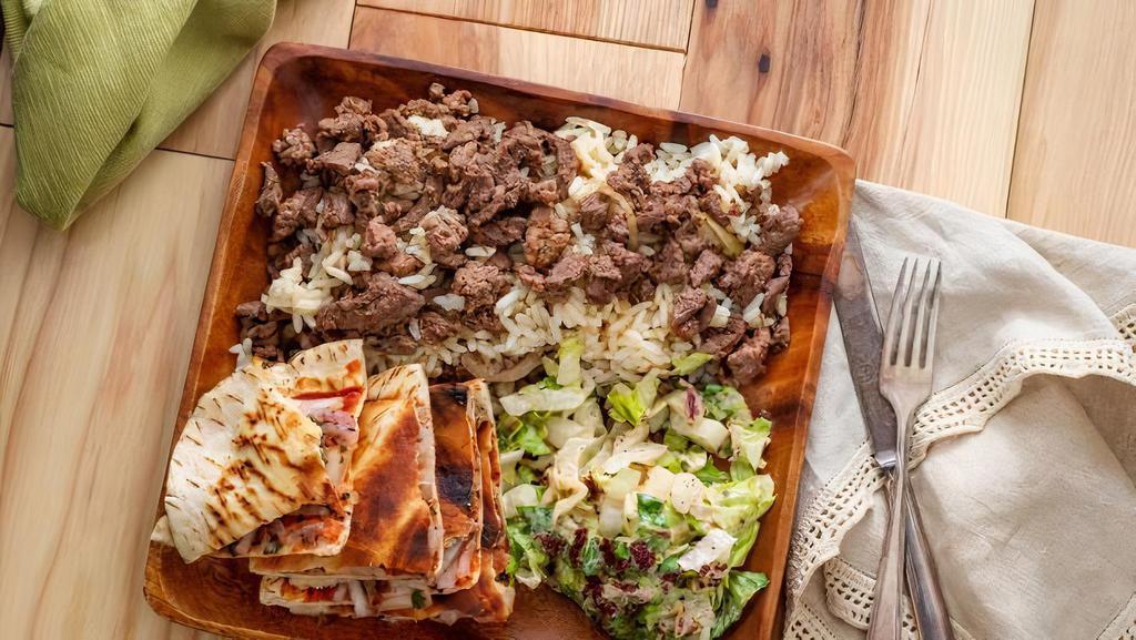 Beef Shawarma Entree · Tender lean beef shredded and marinated in delicate spices then grilled with chef's special touch served with brown rice & lentil soup.