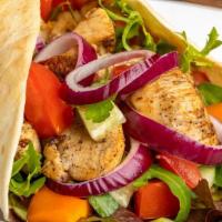 Chicken Kebab Wrap · Marinated spiced chicken a-la-kebab in a soft crepe family recipe topped with lettuce, pickl...