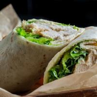 Grilled Chicken Caesar Wrap · A Caesar garlic dressing prepared over grilled chicken breast, romaine lettuce, and topped w...