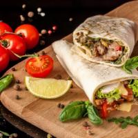 Beef Kebab Wrap · Marinated filet mignon grilled with special herbs, topped with lettuce, pickles, tomatoes, a...