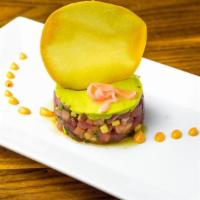 Tuna Tartare · Yellowfin tuna, pickled ginger, mango shallots, wasabi, avocado mousse, pine nuts.