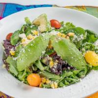 Mixed Greens Salad · Mix greens grape tomatoes, roasted corn, avocado, queso fresco and chipotle dressing.