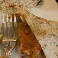 Lobster Quesadilla · Large flour tortilla stuffed with lobster meat, onions, peppers, roasted corn, cheese, serve...