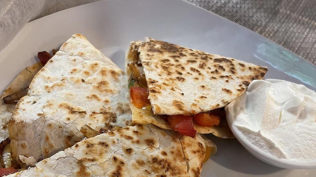 Kids Cheese Quesadilla · Mixed cheese on a flour tortilla with sour cream on the side.