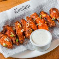 Wings  · 8 pieces (gluten free). 
Choice of: Buffalo,  BBQ, Mango Habanero
Served with blue cheese or...