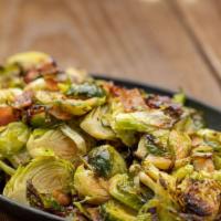 Charred Brussel Sprouts  · Bacon, truffle oil, sriracha drizzle & garlic aioli