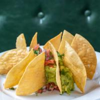 Guac & Chips · Homemade guacamole served with corn chips