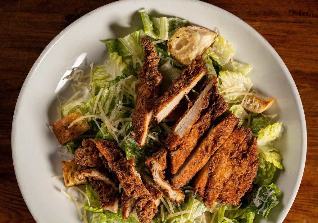 Caesar Salad · Romaine lettuce, shaved parmesan cheese & herbed croutons.