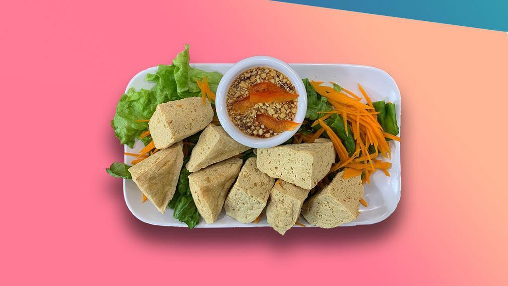 Fried Tofu · Fried tofu until golden served with cucumber, crushed peanuts in sweet chili sauce.