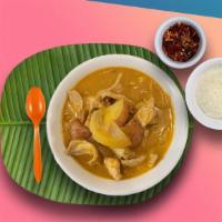 Massaman Curry · Mild massaman curry paste, coconut milk, carrots, onions, potatoes and peanuts.