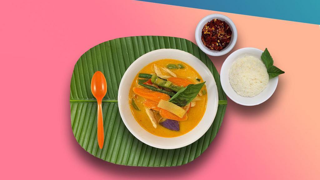 Red Curry · Spicy red curry paste, coconut milk, eggplant, bell peppers, bamboo shoots, carrots, string beans and basil. Served with jasmine rice.