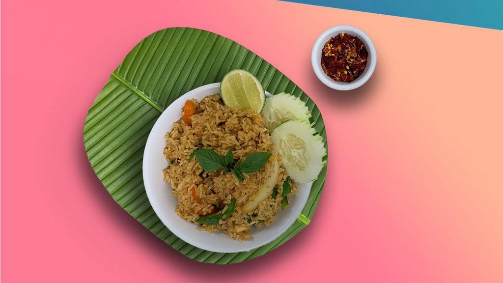 Thai Basil Fried Rice · Jasmine rice stir-fried with namprik pao, bell peppers, onions, and thai basil. Served with choice of meat.