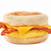 English Muffin Breakfast Sandwich · Seasoned egg omelet, your choice of sausage patty or bacon, and sliced cheddar cheese on an ...