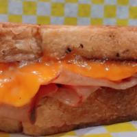 Classic Ham & Cheese · Cooked French ham and sharp cheddar cheese on sourdough pullman bread.