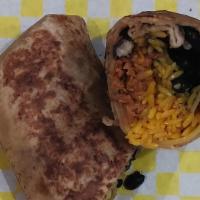 Vegan Burrito · Yellow Spanish rice, Black beans, vegan cheese, and vegan sausage. Wrap in a whole wheat tor...
