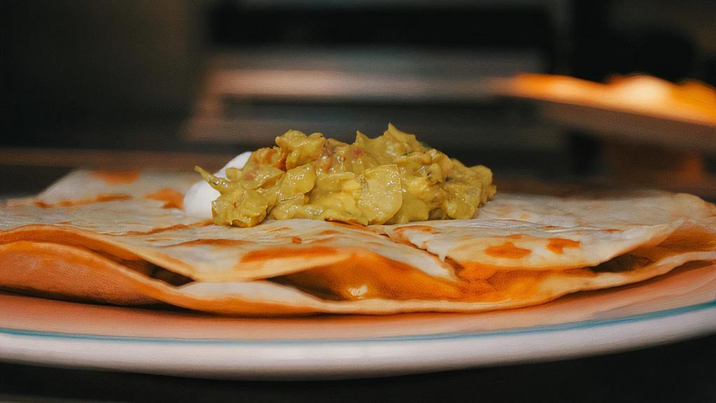 Lg Quesadillas · Flour tortilla with Cheese. Served w/ Guacamole, Sour Cream & Salsa